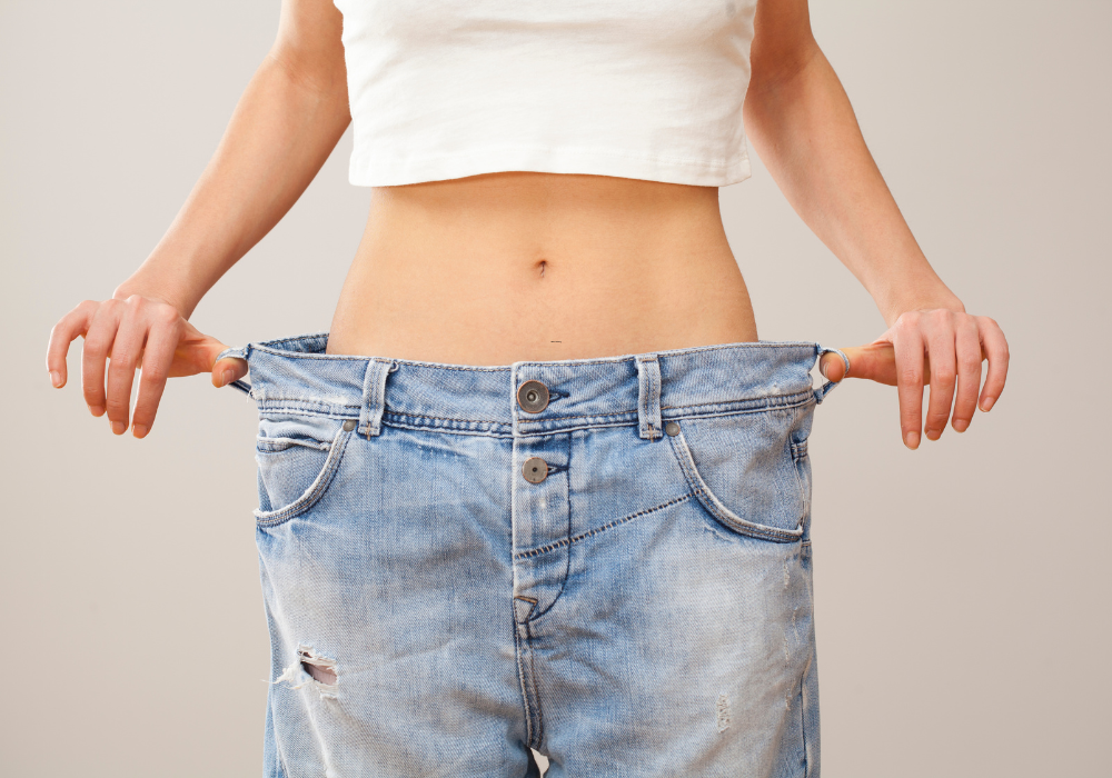 woman displaying the benefits of weight loss injections in Alexandria