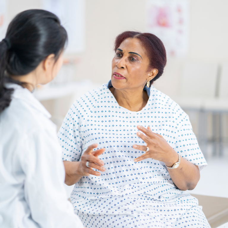doctor and patient discussing cellulite reduction cost near Alexandria