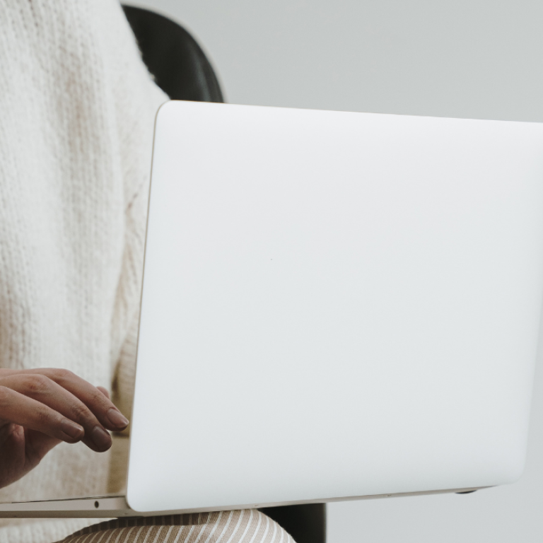 woman researching Emsculpt body contouring cost in Arlington