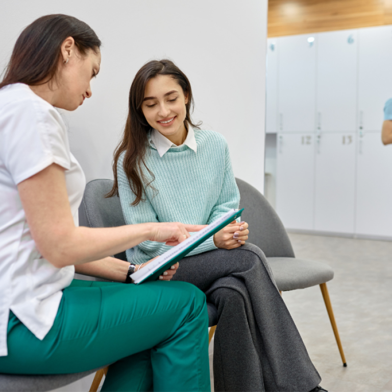 women discussing Emsculpt Neo cost and muscle toning benefits near Fairfax