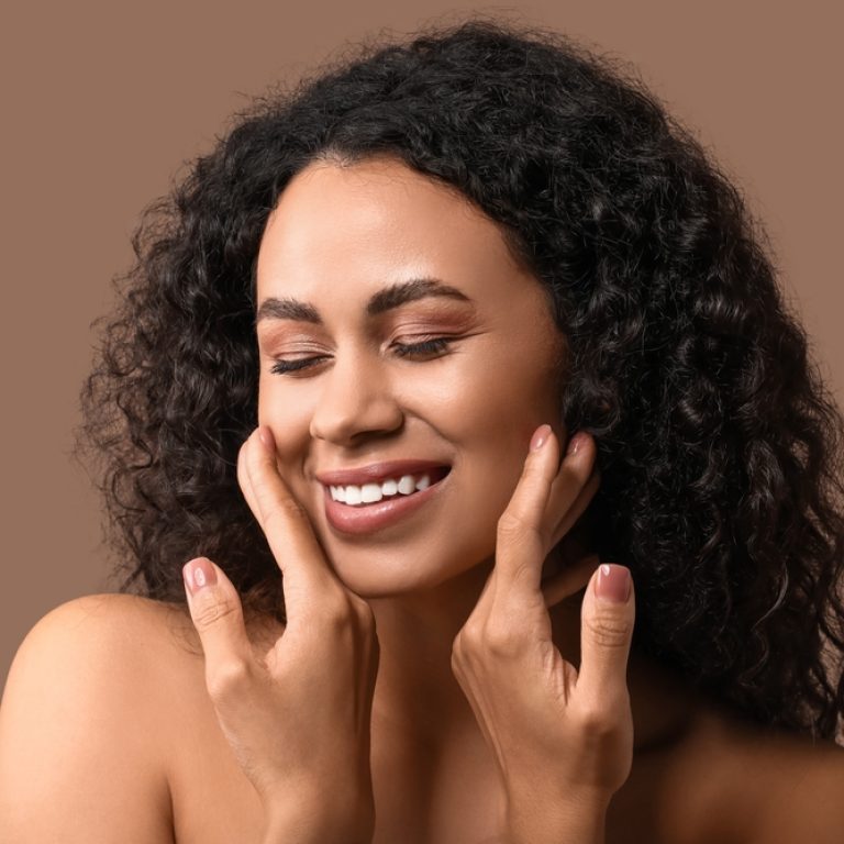 woman after peptide therapy for skin rejuvenation in Arlington