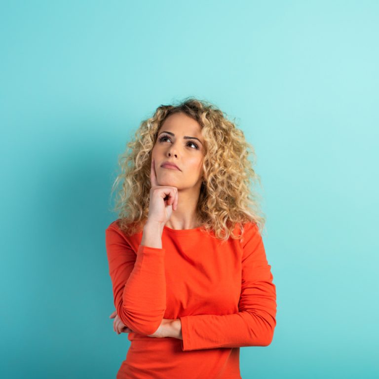 woman considering CoolSculpting or Emsculpt
