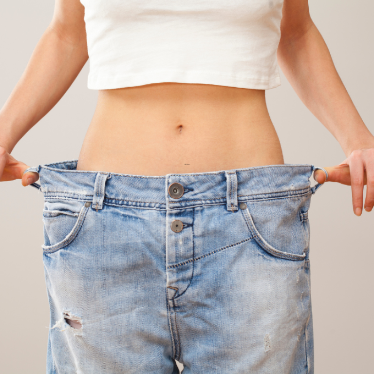 woman displaying the benefits of weight loss injections in Alexandria